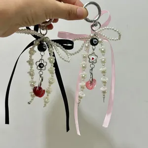 Y2K beaded keychain with silk bow and heart pendant, handmade accessory for bags