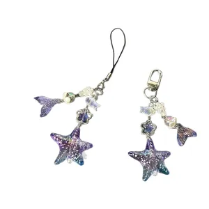 Sparkly mermaid tail and starfish handmade beaded phone charms in purple and blue