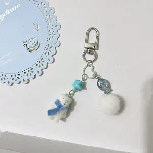 Cute flocked white bear keychain with blue star beads and soft pompom bag charm