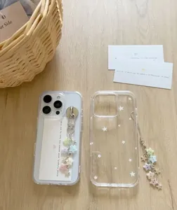 Detail of star-themed phone cases with colorful beaded lanyards on a wooden background