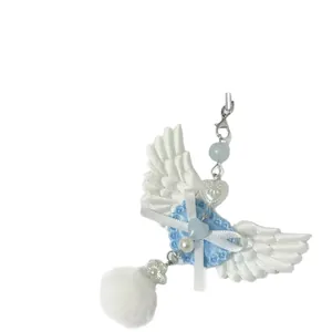 Porte-clés ailes d'ange Y2K avec dentelle bleue, nœud blanc et pompon en peluche doux
