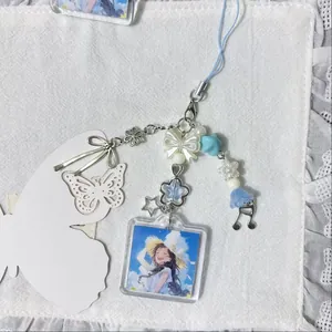 Blue anime girl acrylic frame keychain with star beads and floral metal charms