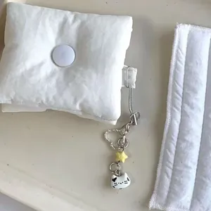 Cat face fabric protective case with handmade beads and star charm on a metal keyring