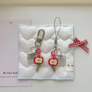 Handmade red apple charm phone strap with metal heart chain and inspirational tag