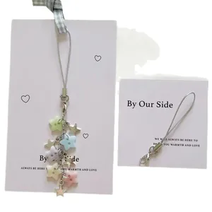 Star-themed handmade beaded phone charm with multi-color stars and silver clasp