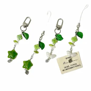 Green lucky four-leaf clover keychain and phone charm set with beads and leaf charms