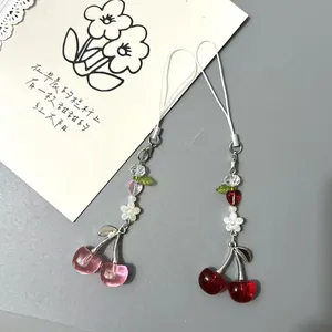 Sweet pink and dark red cherry beaded phone charms with resin petals and green leaves