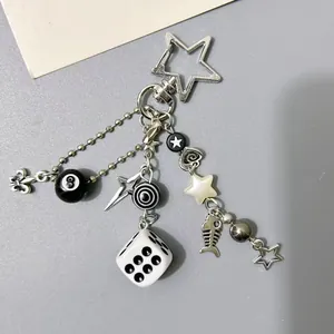 Y2K style silver keychain with 8-ball, dice, and stars charms for bags and accessories