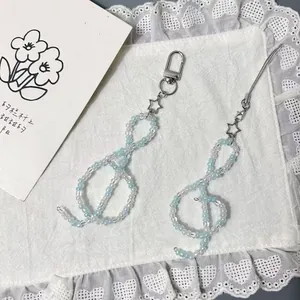 Blue and white beaded G-clef phone strap with silver star charm and metal clasp