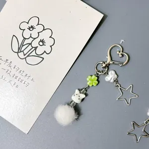 Cute bunny keychain with white pompom, heart clasp and lucky clover pendant