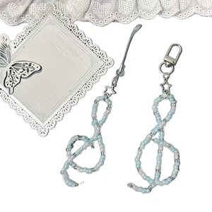 Handmade blue and white beaded mobile phone lanyard with music note and silver star charm