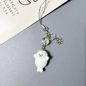 Cute white plush seal keychain with silver snowflake charm and heart-shaped metal clasp