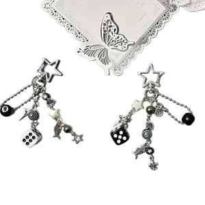 Y2K punk style silver keychain with dice, 8-ball, and star charms on white background