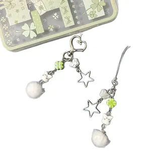 Cute bunny keychain with white pompom, heart buckle, and green clover charms