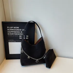 Fashionable black matte tote bag set with silver charms on chain for autumn winter 2025