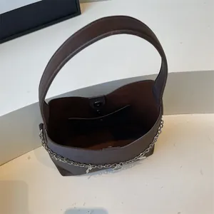 Brown faux leather tote bag with silver chain detail and magnetic closure