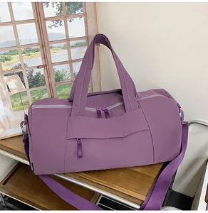 Macro shot of purple travel tote bag showing durable fabric and front zipper detail