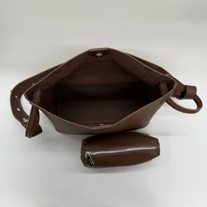 Brown litchi pattern bucket bag with inner pouch and magnetic snap closure