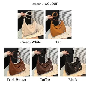 Detail view of large tote bags in beige, brown, and black with smooth leather textures
