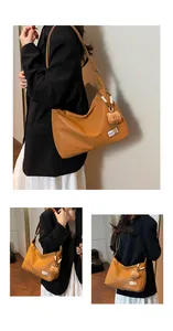 Detail of a brown leather tote bag showing a plush bear charm and fashion label tag