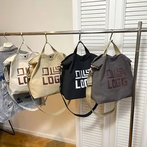 Minimalist canvas tote bags in four colors with adjustable straps for school or travel