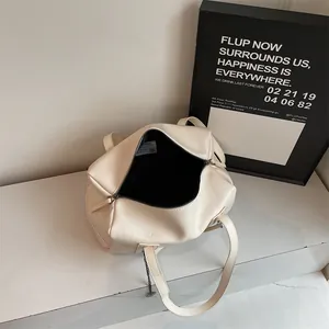Minimalist cream white Boston tote bag with spacious interior and black lining