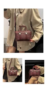 Detail shots of burgundy boston bag with woven texture and adjustable shoulder straps
