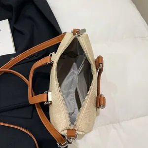 Boston style beige woven handbag with brown leather handles and silver hardware for women