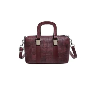 Vintage burgundy Boston bag with textured finish and adjustable shoulder strap