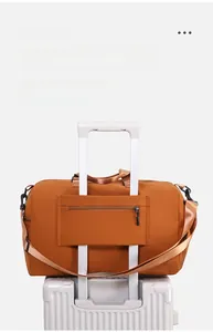 Travel bag detail showing the rear trolley sleeve and hidden zipper pocket on white suitcase