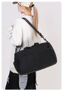 Detailed side view of a black versatile travel bag with mesh pocket and shoulder strap