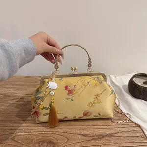 Yellow silk evening bag with floral embroidery and tassel, Chinese vintage style handbag
