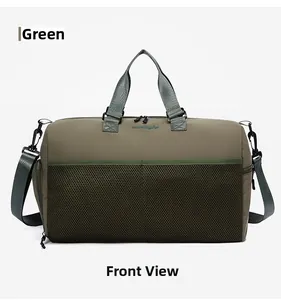 Macro view of green travel bag showing black mesh pocket and fine embroidered logo details
