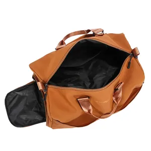 Caramel brown large travel duffel bag with shoe compartment and starlight logo