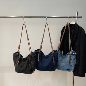 Vintage denim tote bags with thick rope straps in black, deep blue, and light wash