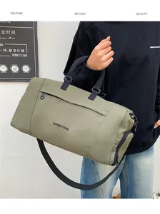 Detail of olive green oxford fabric travel bag with durable black straps and brand logo