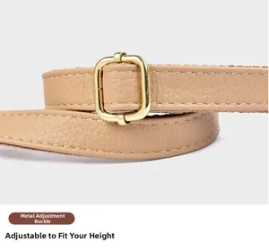 Detail of adjustable leather shoulder strap with gold buckle for crossbody bucket bag