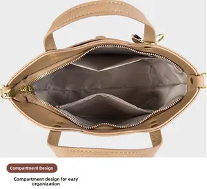 Close-up of internal compartment design and herringbone lining in the light brown bucket bag