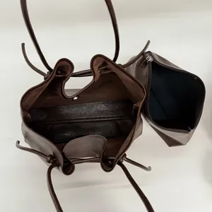 Brown faux leather tote bag set with matching zipper pouch and magnetic snap closure