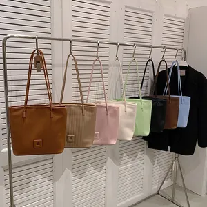 Chic pleated tote bag in various colors with vertical plissé texture for women