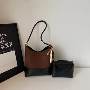Retro colorblock tote bag in brown suede and black faux leather with beaded charm