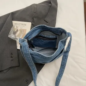 Sac seau rétro en jean délavé pour femme avec poches intérieures et bandoulière large