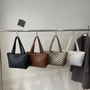 Quilted tote bags in four colors featuring diamond stitching and large capacity handles