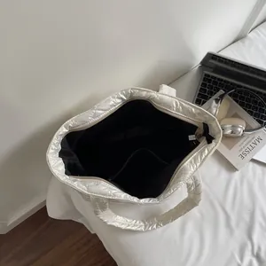 White quilted tote bag with pearl finish and large capacity shown from top view