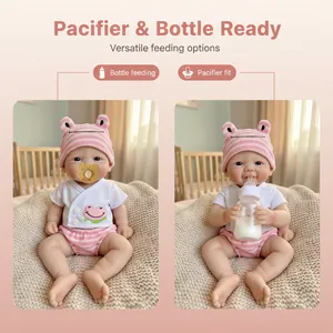 Detail of 12-inch silicone baby doll with frog hat, pacifier, and feeding bottle