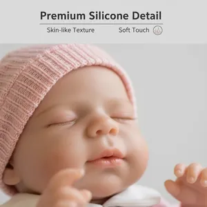 Realistic 12 inch solid silicone reborn baby doll with pink knitted hat and sleeping face