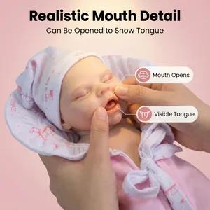 12-inch realistic solid silicone reborn baby doll with lifelike mouth and pink outfit