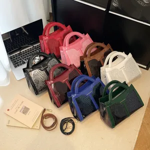 Glossy leather tote bags in eight colors featuring snakeskin texture and top handles