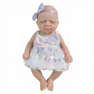 12 inch realistic reborn baby doll in floral print dress with purple bow and lace trim