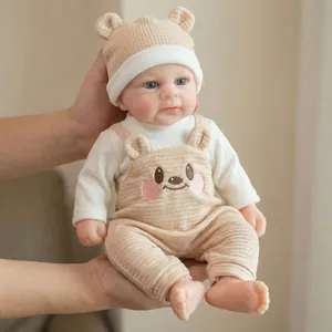 12-inch realistic reborn silicone baby doll in bear overalls with matching knit hat